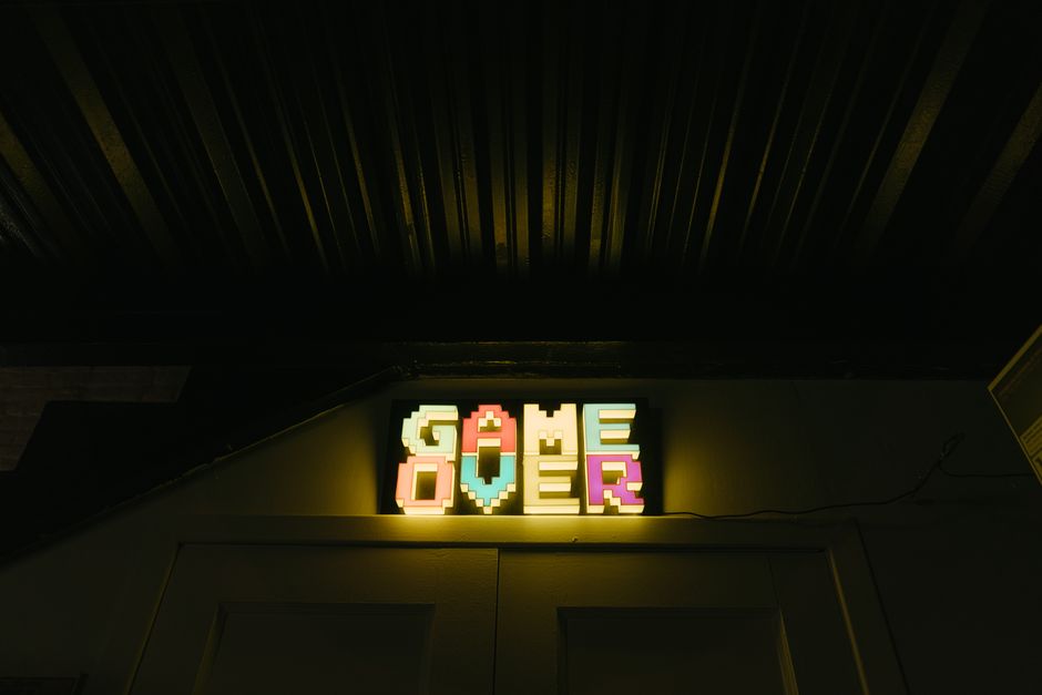 game developer studio, neon arcade controller, pixel art workspace
