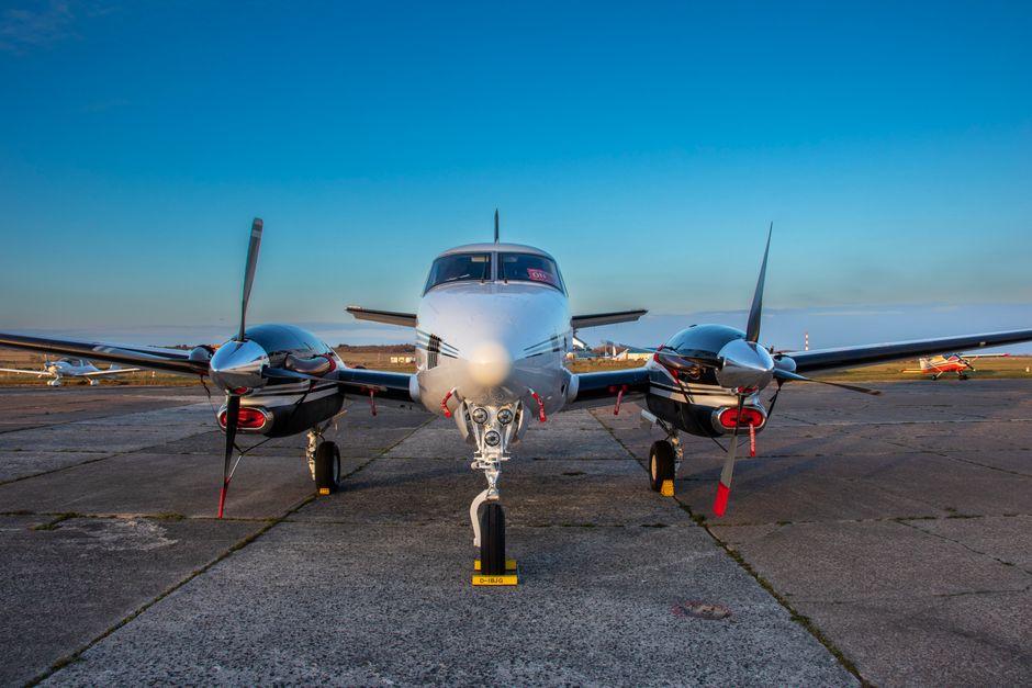 ubisoft headquarters logo, twin-engine private plane, thrustmaster flight stick