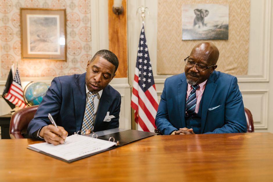 founding fathers signing document, laptop american flag, declaration of independence parchment