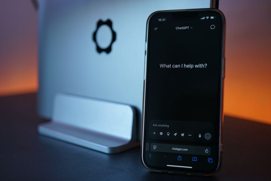 smartphone office desk, mobile ai assistant, laptop closed workspace