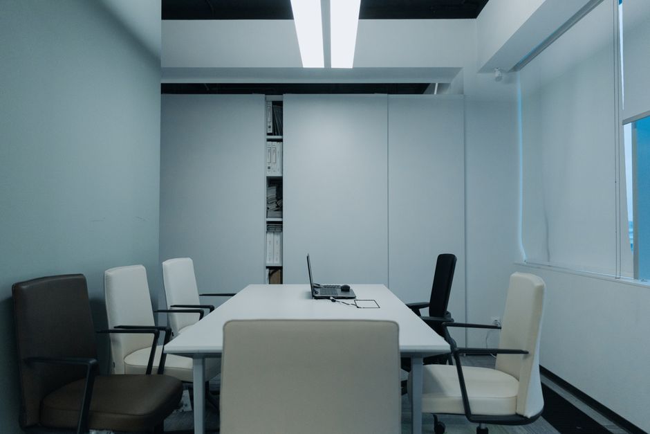Magic: The Gathering trading cards, corporate office exit, boardroom empty chair