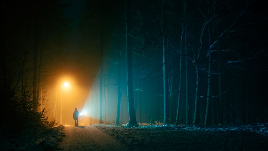 foggy abandoned town at night, dark horror hallway, flickering flashlight fog