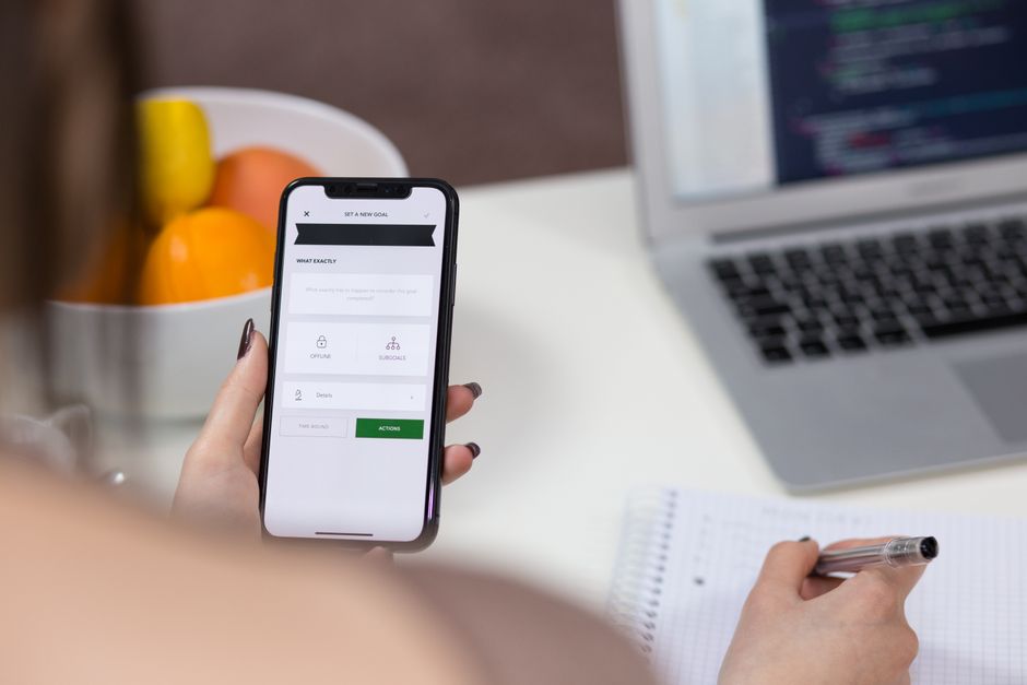 smartphone chat interface, data center servers, person typing laptop