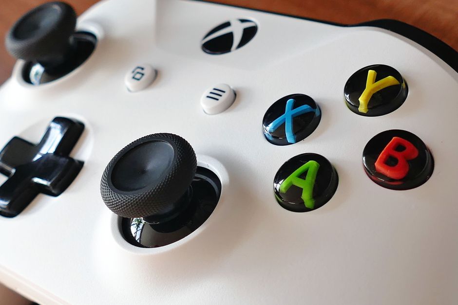 xbox controller close-up, id card verification smartphone, video game store shelf