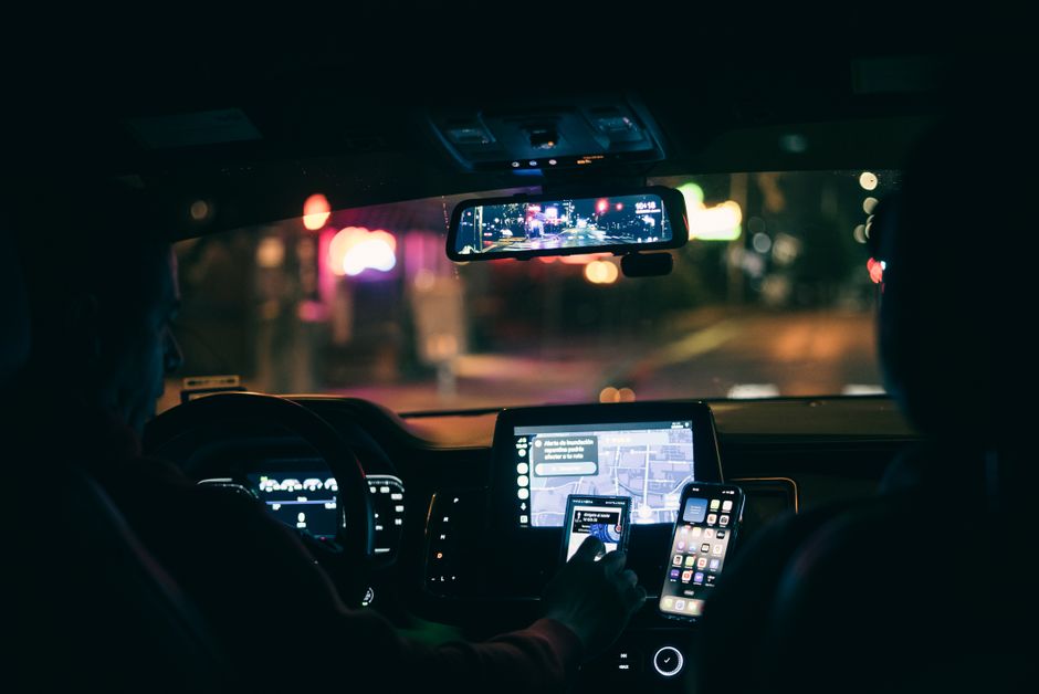 rideshare car interior at night, video game developer workstation