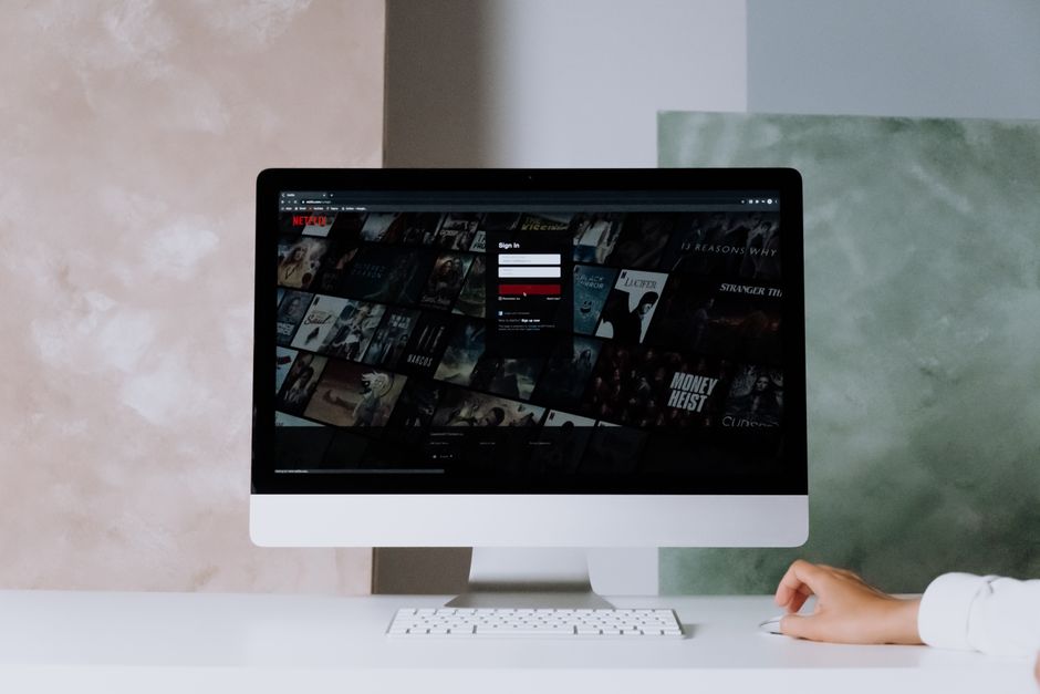 empty office desks, netflix logo screen, closed sign door