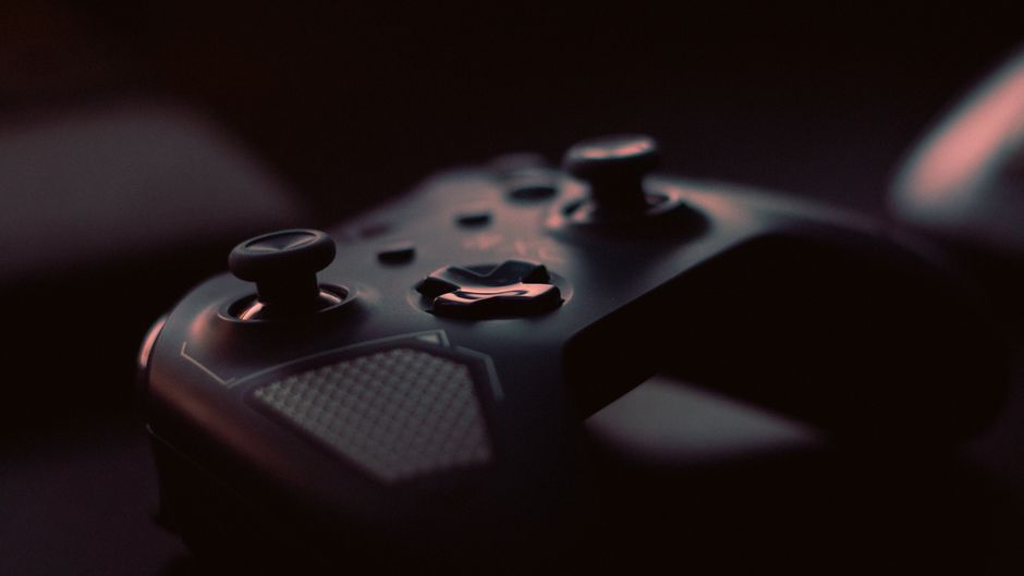 video game controller close-up, tokyo street at night