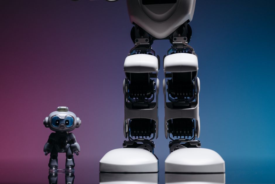 small bipedal robot toy, robot on desk workshop
