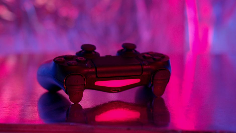 gamescom convention gaming crowd, video game controller neon light