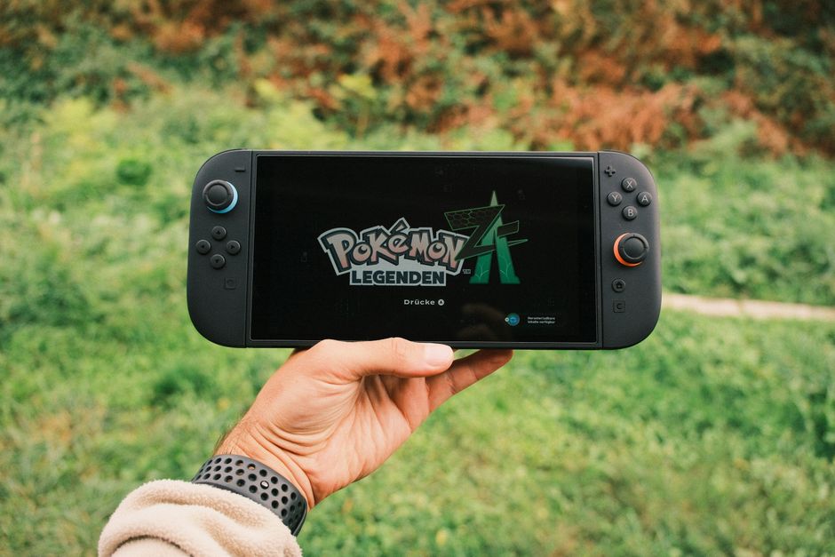 nintendo switch 2 console, friends playing video games on couch, split screen racing game tv