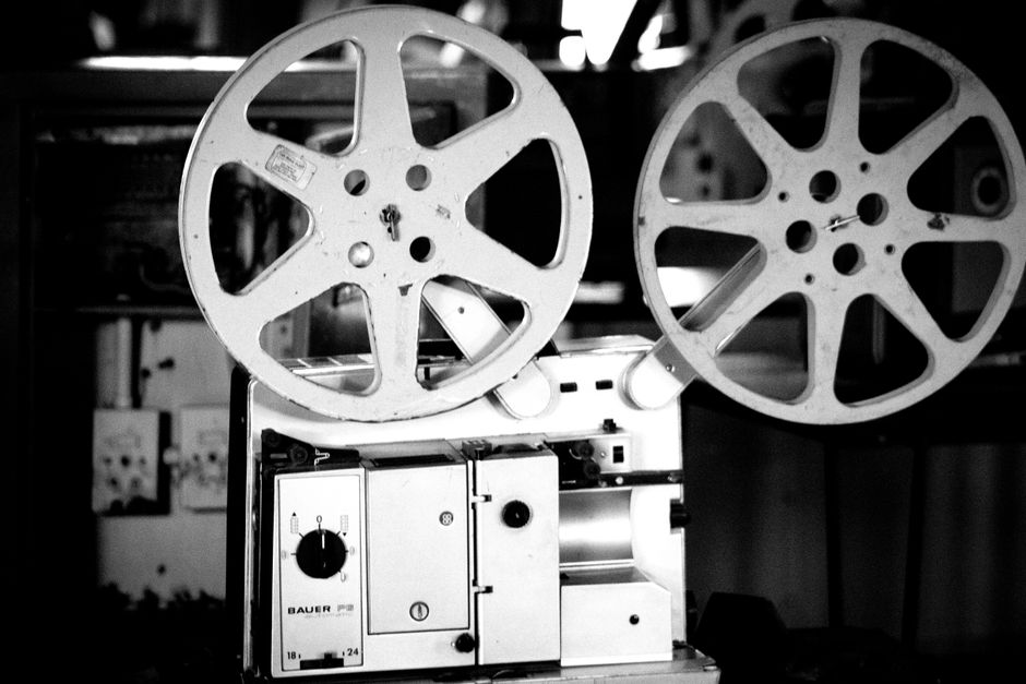 zombie silhouette dark alley, film reel projector